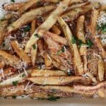 the ultimate indulgence: double fried fancy french fries with garlic butter and parmesan