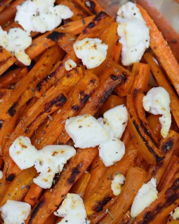 roasted charred carrot sticks with melty goat cheese