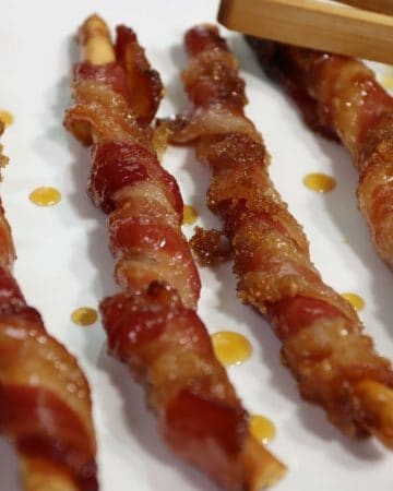 closer look at brown sugar bacon sticks brushed with maple syrup