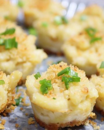 side view of a platter of cute little mac & cheese mini muffins