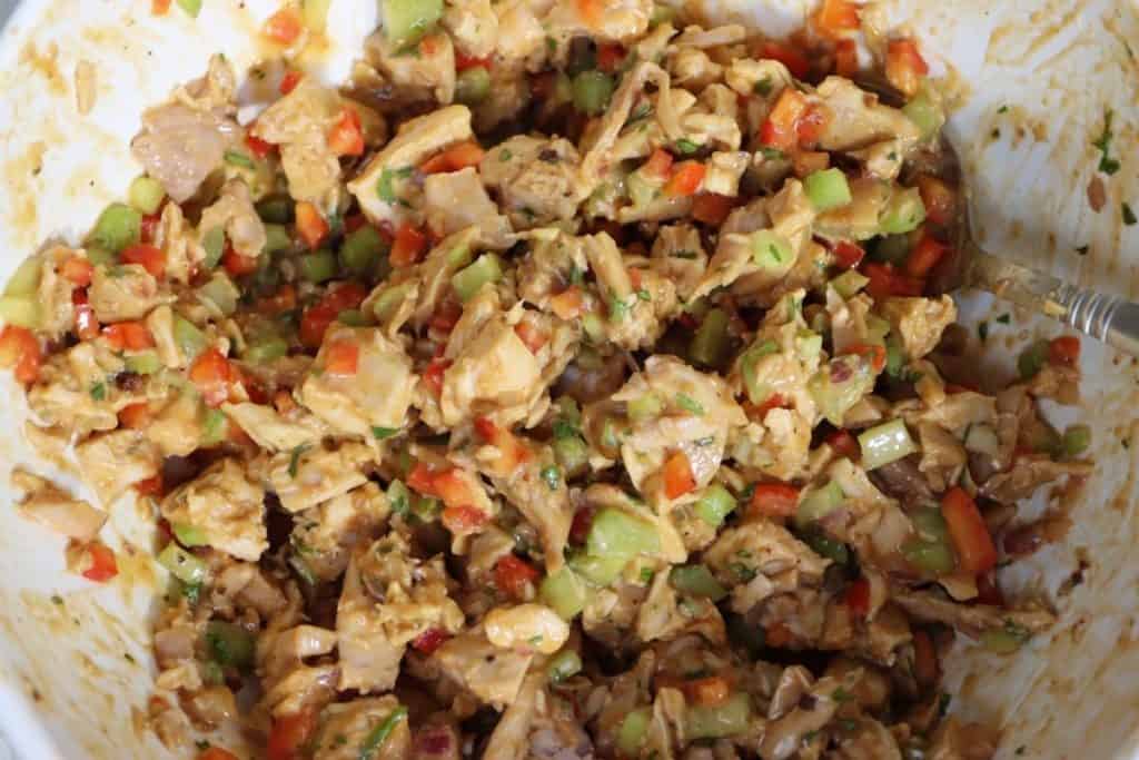 close up of the thai chicken mixture with rotisserie chicken, celery, onion, red pepper and thai peanut sauce