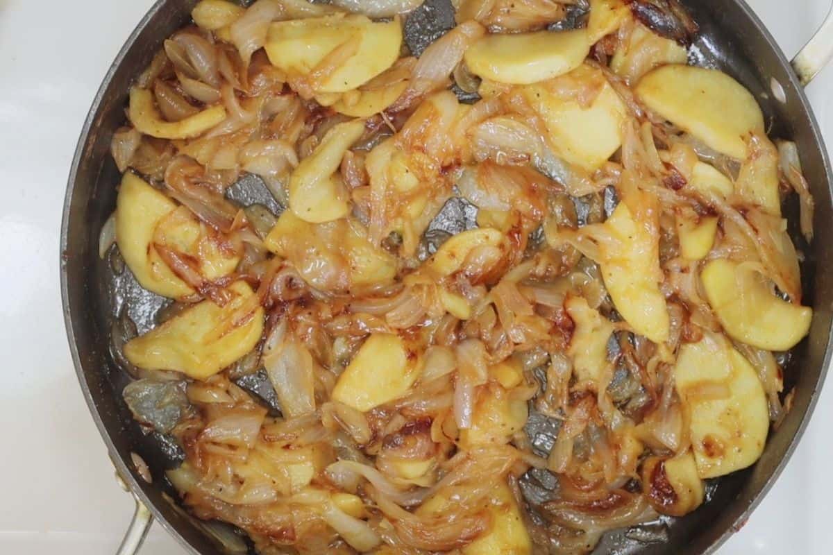 overhead view of a pan of caramelized onions and tender apples