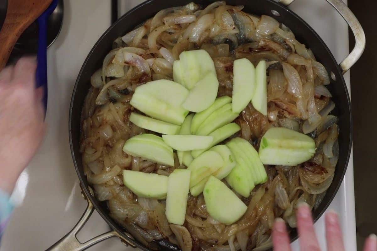 overhead view of pan with caramelized onions when the apples were added