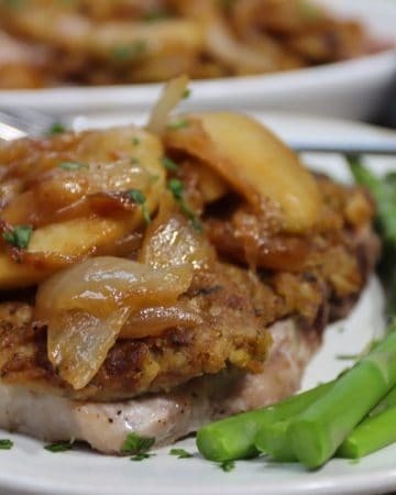 front view of pork chops with stuff top stuffing caramelized onions and apples