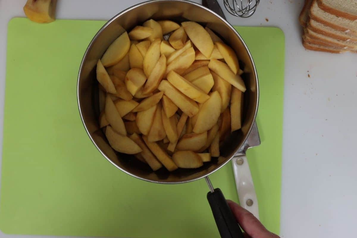 after cutting peaches into wedges put in a pot to cook