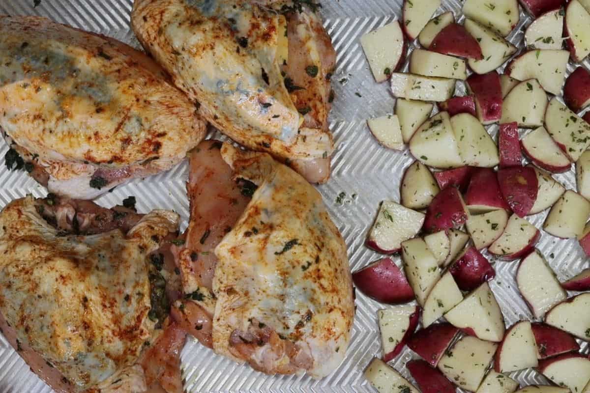 sheet pan dinner before the oven bone-in stuffed chicken breast with spinach and gouda with rosemary red bliss potatoes