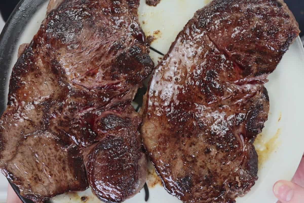 two petite new york sirloin steaks right out of the pan and nice and juicy