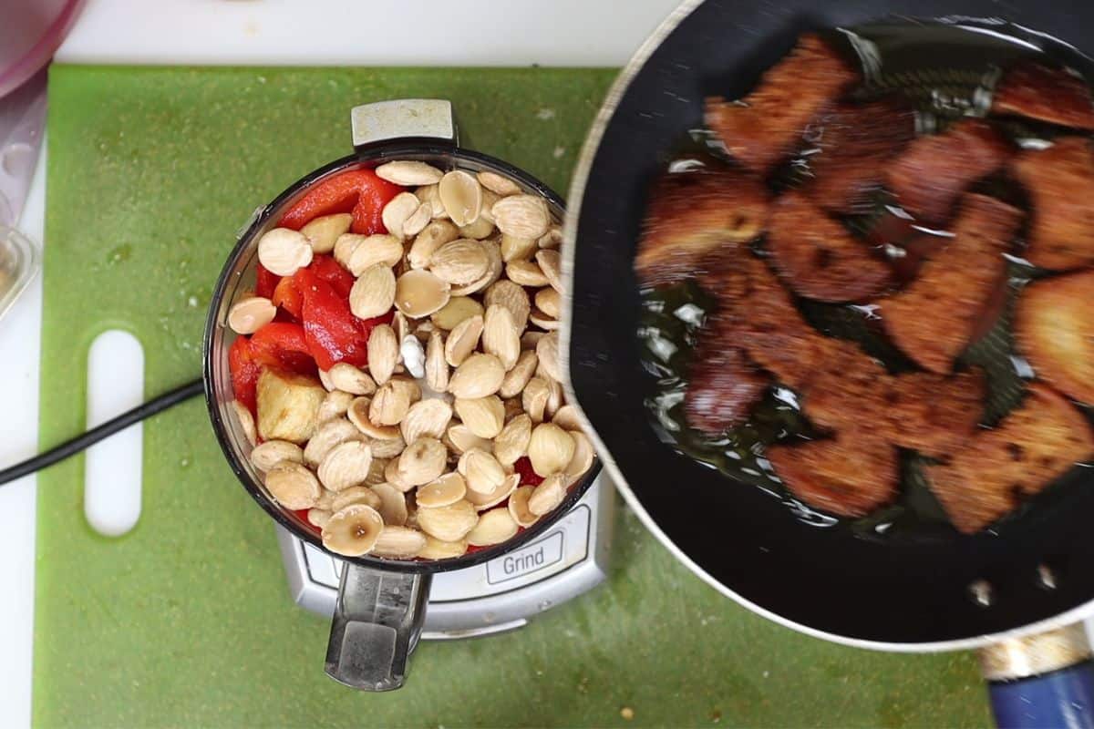for romesco all ingredients go right in the blender: roasted red peppers, almonds, fried bread cubes, red wine vinegar