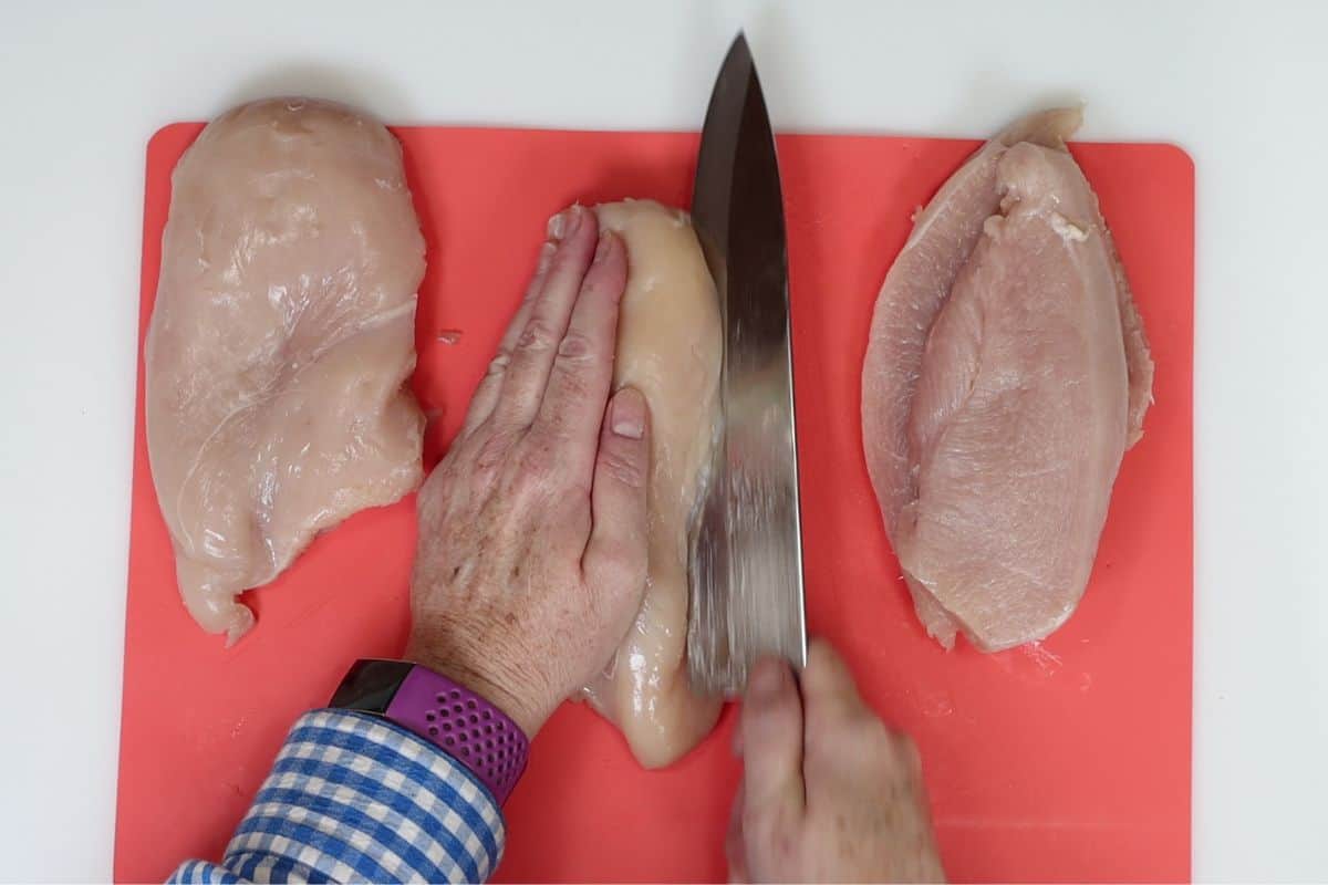 cut your three boneless breast of chicken pieces in half lengthwise to make six pieces