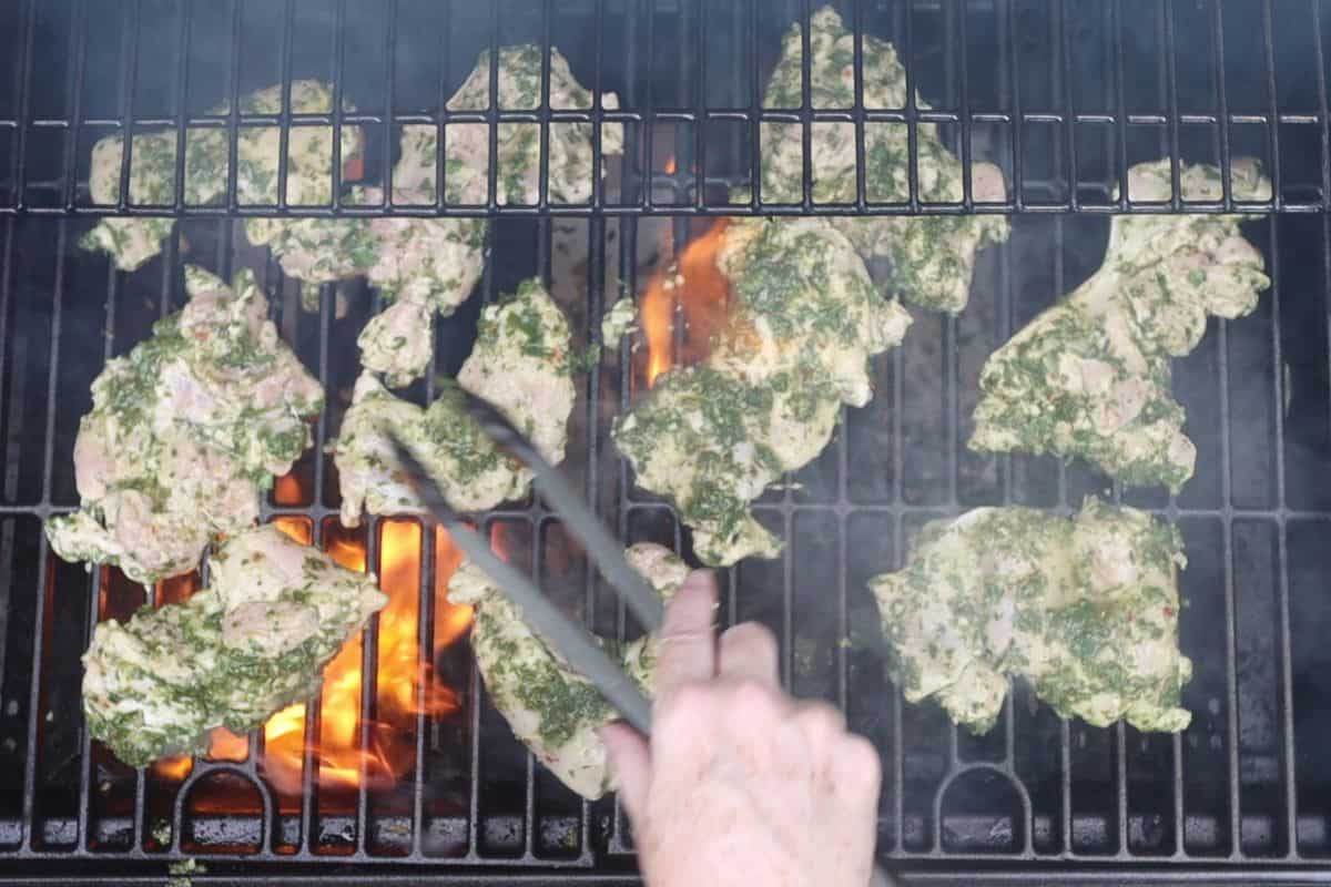 heat your grill on high for 10 minutes then place the marinated chicken thighs onthe grill