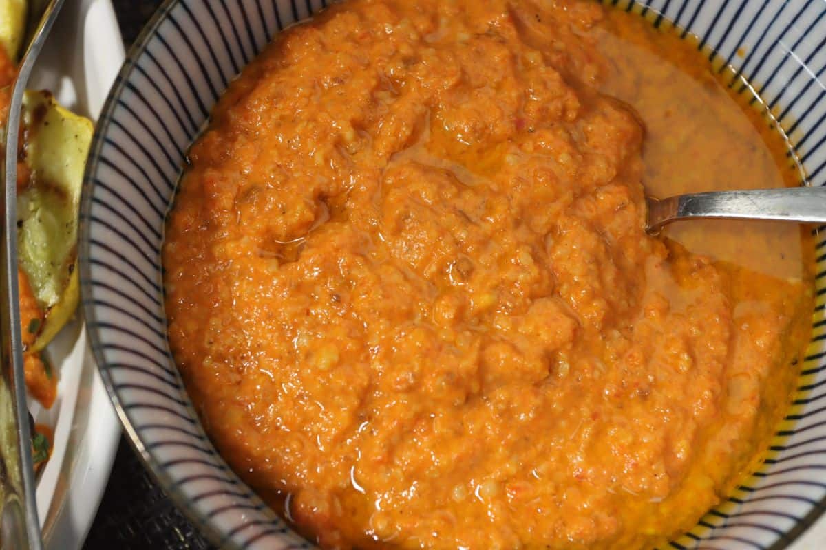 bowl of romesco sauce - a roasted red pepper sauce perfect for topping grilled vegetables