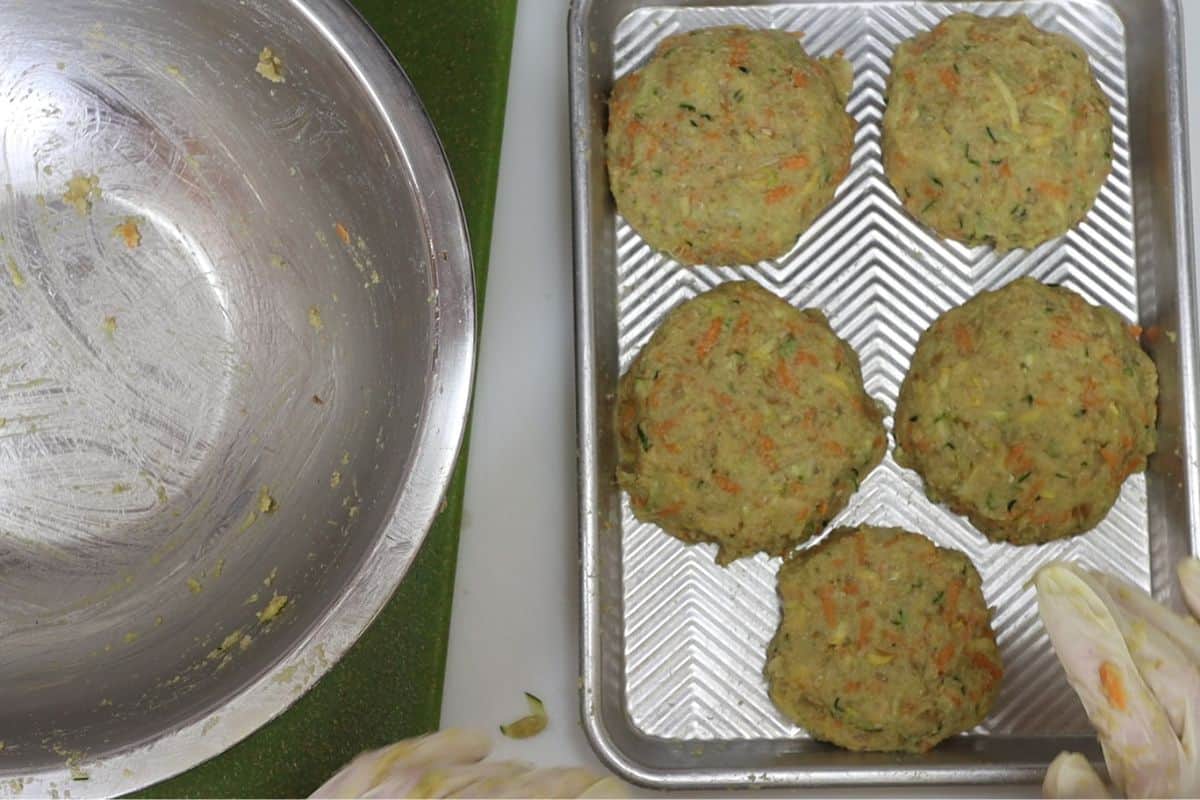 7-steps to making chickpea veggie burgers-form patties place on sheet pan. Freeze for 30 min to firm