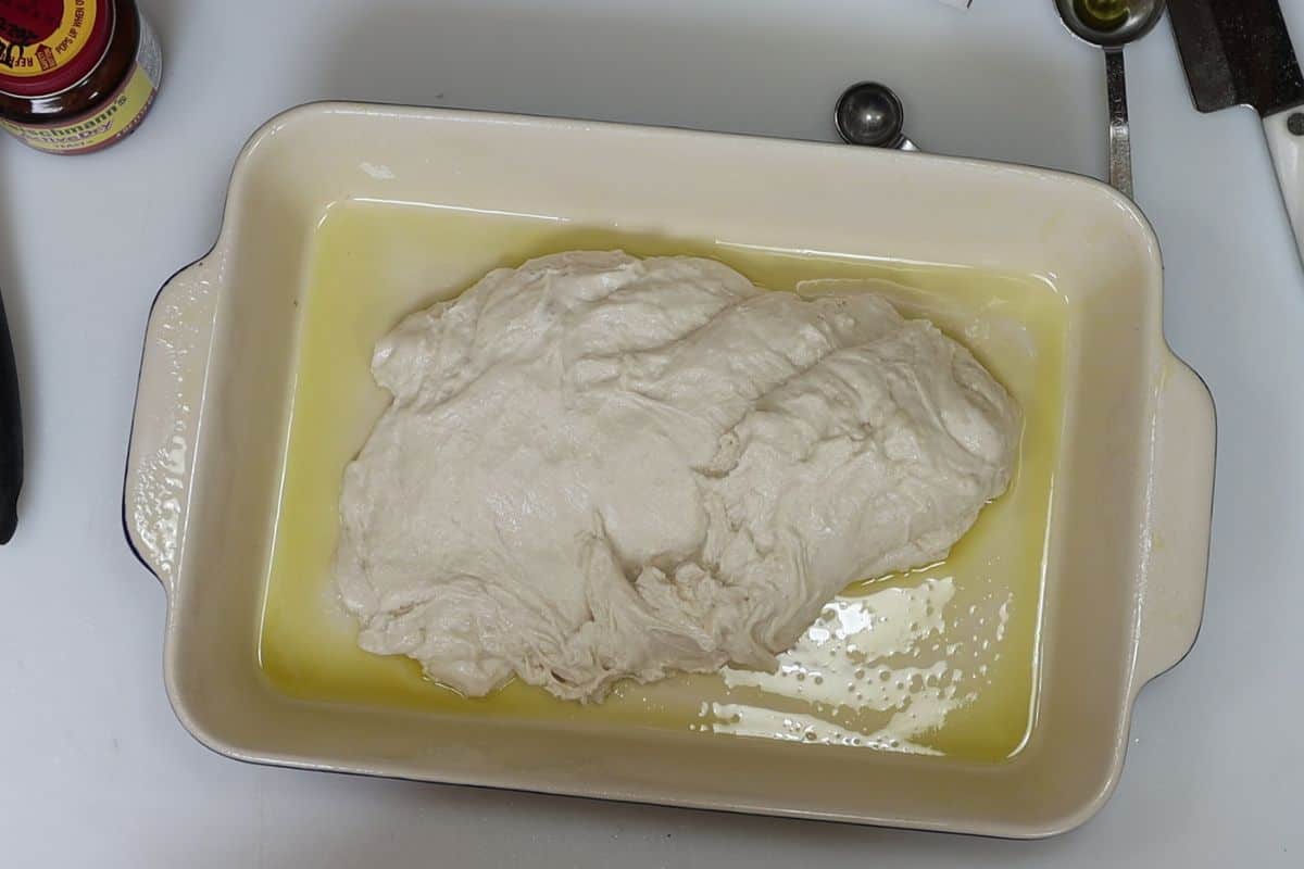 7-steps to making focaccia bread-transfer dough to greased pan