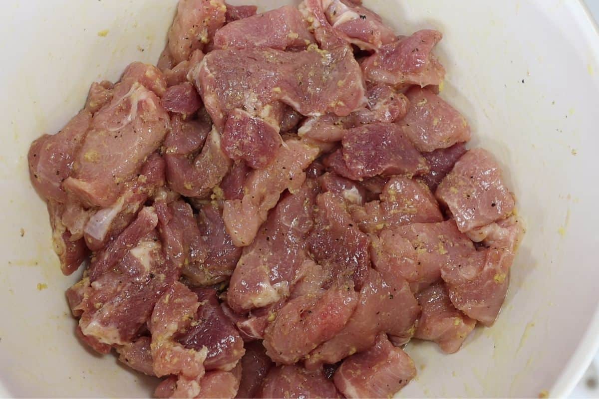 marinate the pork with grated ginger, salt, pepper and olive oil overnight in the refrigerator