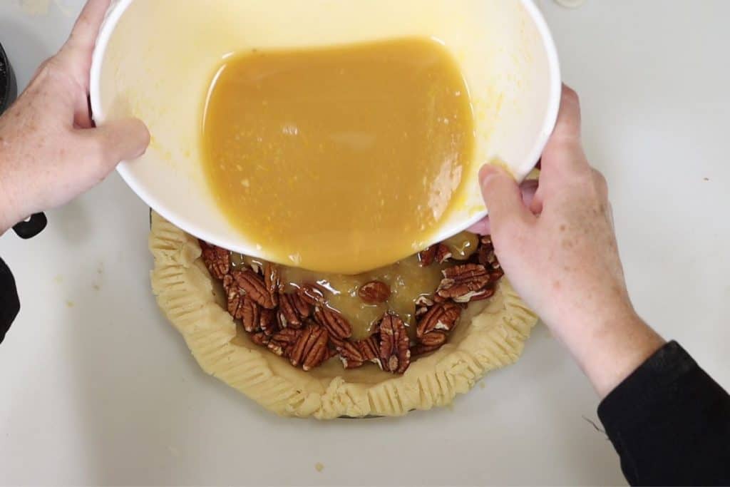 pour the pie filling over the pecans