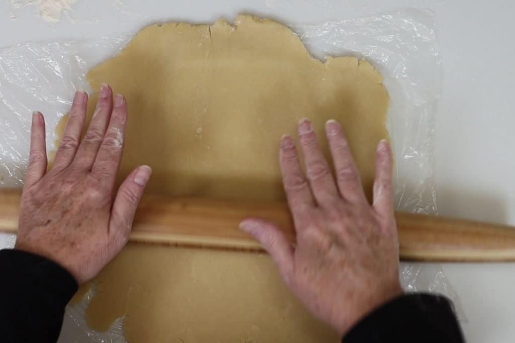 roll the dough up and down and side to side until it forms a circle