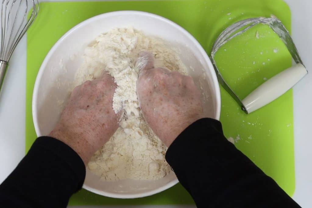 use a pastry cutter or y our hands to miss the butter and flour to form the dough