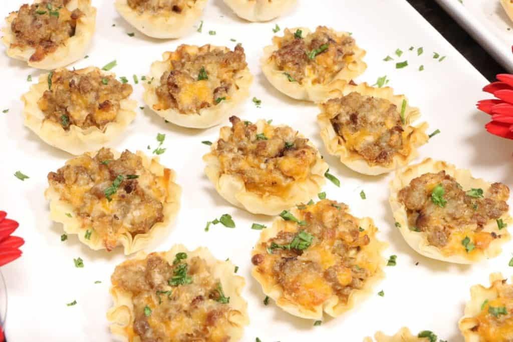 holiday appetizers phyllo cups five ways mild italian sausage with cheddar and cream cheese garnished with fresh chopped chives