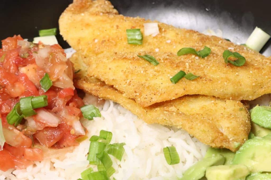 McCormick Fish Fry Flounder: a very close looked at the crispy fried fish on basmati with pico de gallo, avocado and scallions
