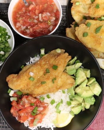McCormick Fish Fry Flounder: wide overhead view of one portion with more fish on a platter, avocado, pico de gallo and scallions