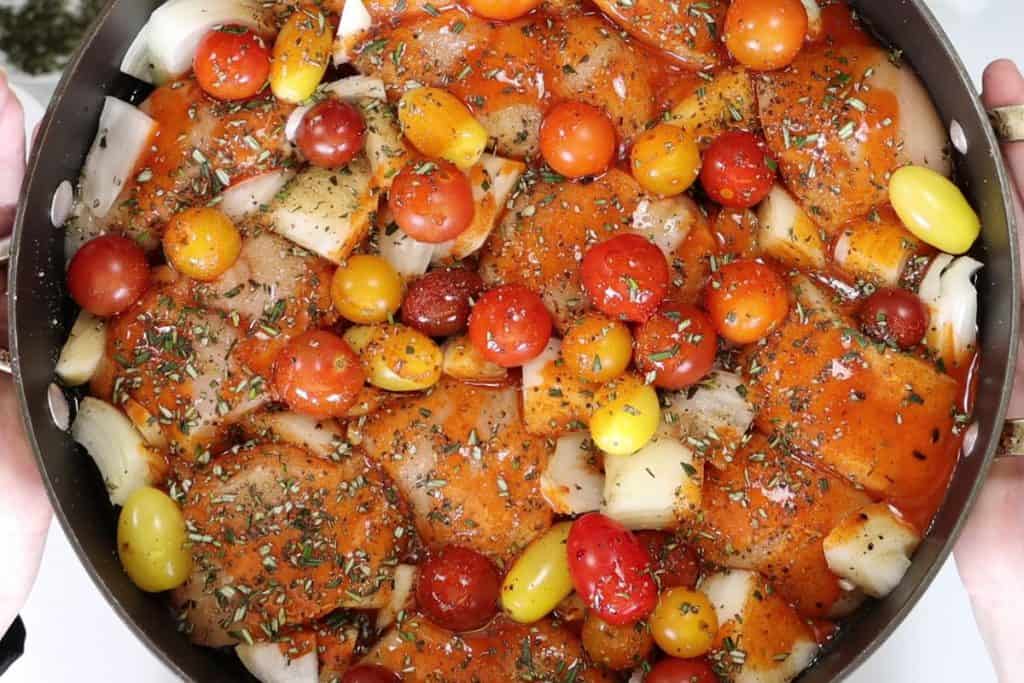 balsamic cholula chicken: add the onions, cherry tomatoes, balsamic vinegard, cholula sauce, salt, pepper and rosemary to pan with chicken