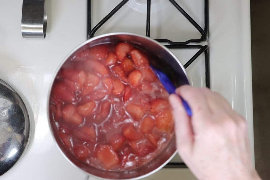 after the strawberries cook remove from heat and let them cool down to room temp