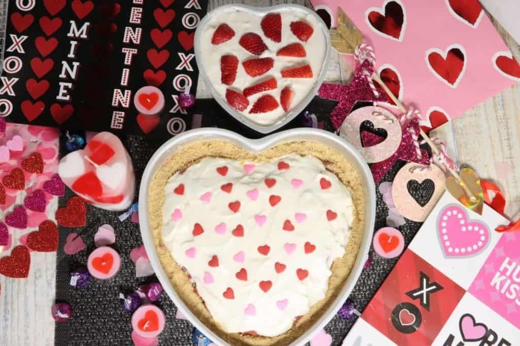 overhead view of the 6 inch and the 10 inch valentine's day strawberry love pie