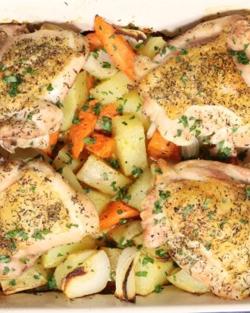 Cheap and Easy Dinner Chicken Thighs, Carrots, Potatoes & Onions - overhead view of baking dish right out of the oven