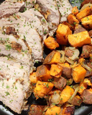 Cheap and easy dinner dijon pork roast and sweet potatoes on a platter garnished with fresh parsley