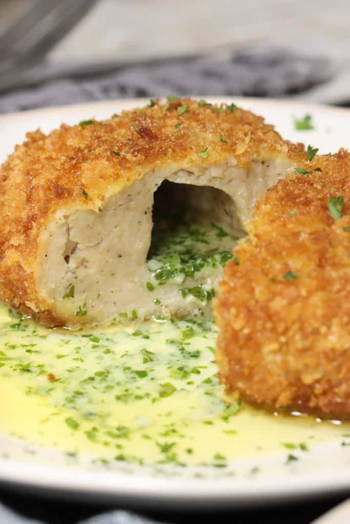 dinner for two ground chicken kiev: inside view of chicken cut in half filled with garlic parsley butter