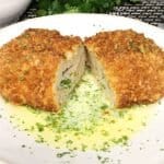 dinner for two ground chicken kiev in a pool of parsley garlic butter