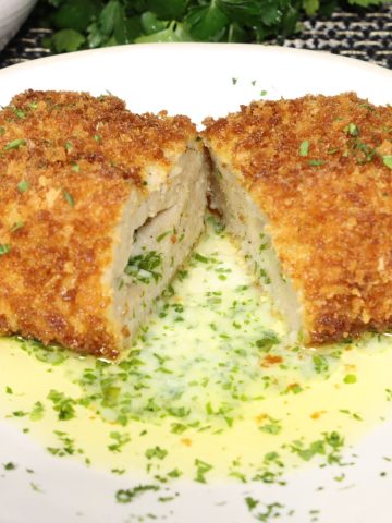 dinner for two ground chicken kiev in a pool of parsley garlic butter