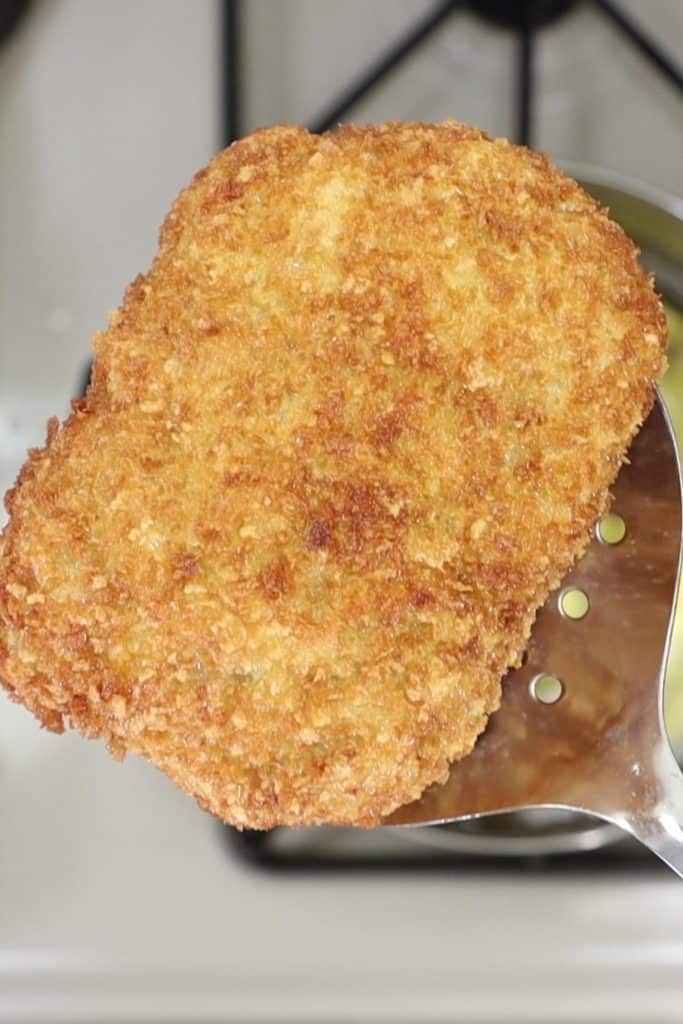 removing fried chicken kiev from the oil