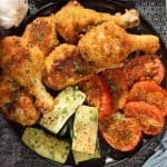 extra crispy shake-n-bake drumsticks with veggies on a platter garnished with parsley