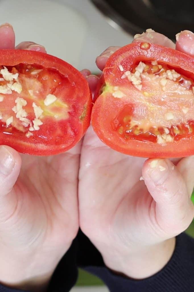 plum tomatoes cut in half with finely diced garlic