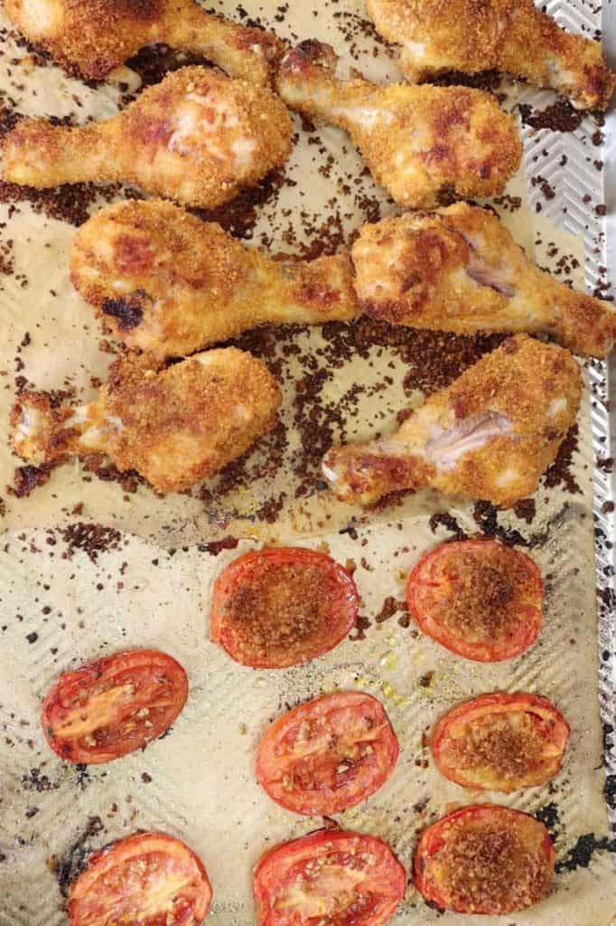 shake-n-bake drumsticks and tomatoes right out of the oven