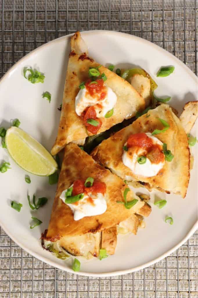 got leftovers? warm the sriracha lime chicken and make a quesadilla like this one with salsa and sour cream