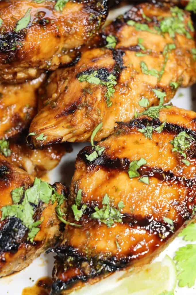 close up look of grilled sriracha lime chicken on a plate