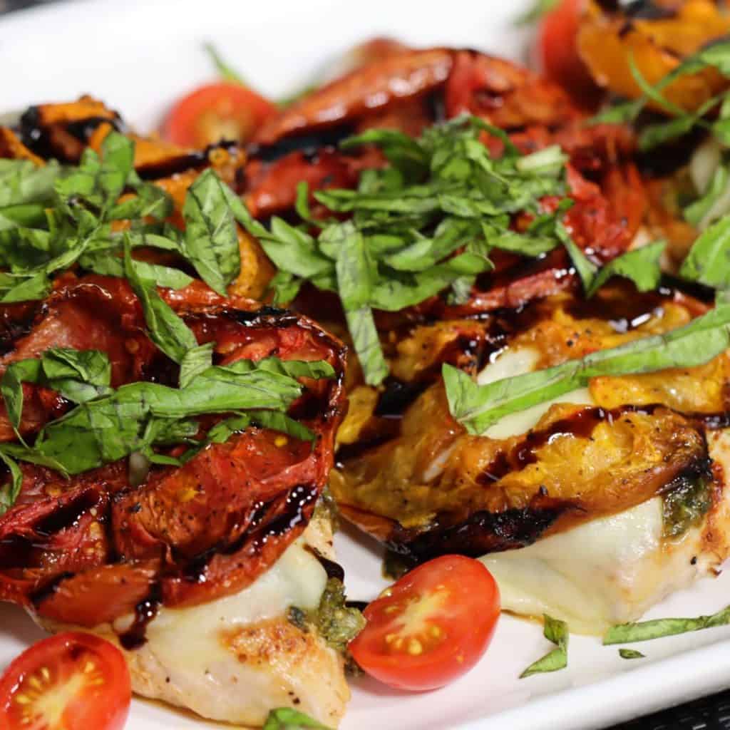 closer look at pan seared chicken caprese with roasted tomatoes and basil