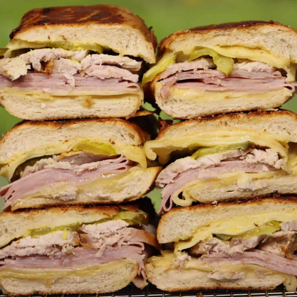 easy pressed cuban sandwiches stacked on top of each other