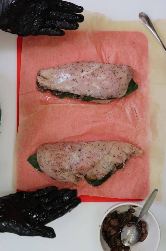 stuffed and folded chicken breasts ready to go in the oven