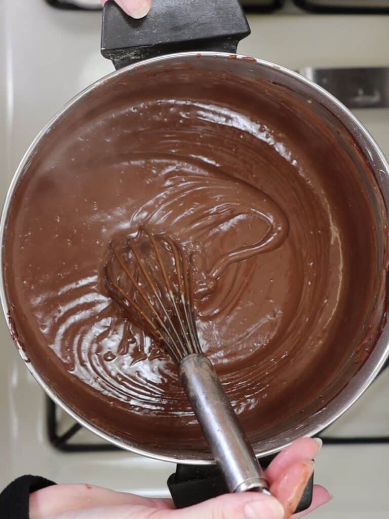 overhead view of chocolate cream pie filling after cooking all ingredients in a pot