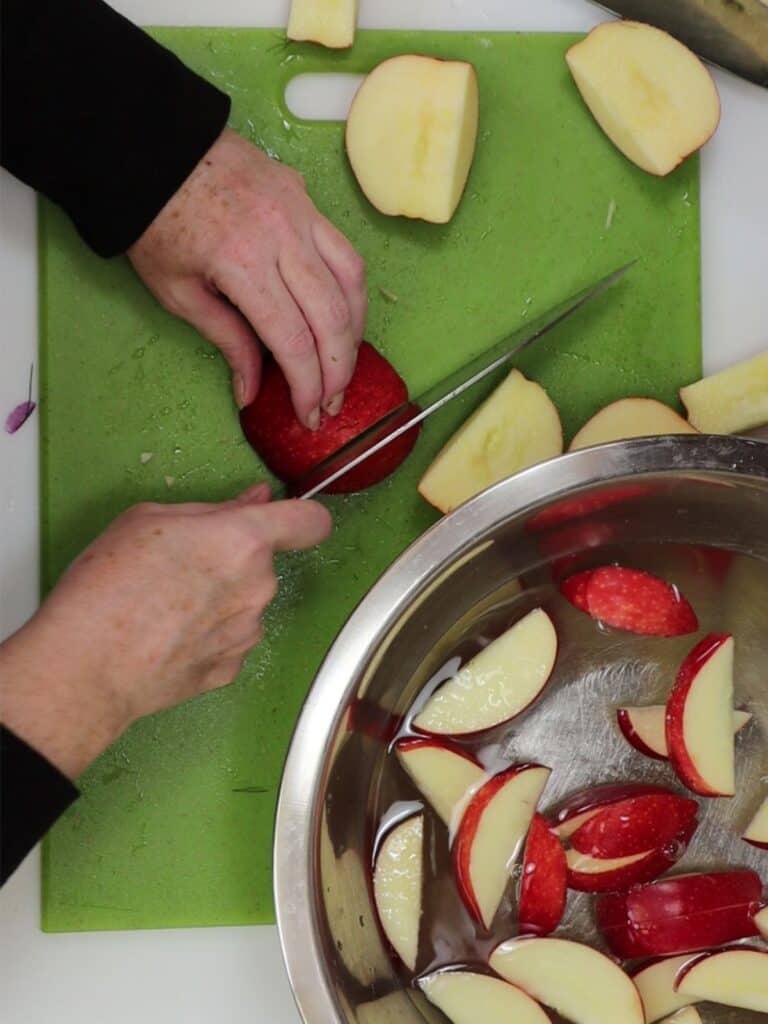cut around the core of apple then slice into half-moon slices