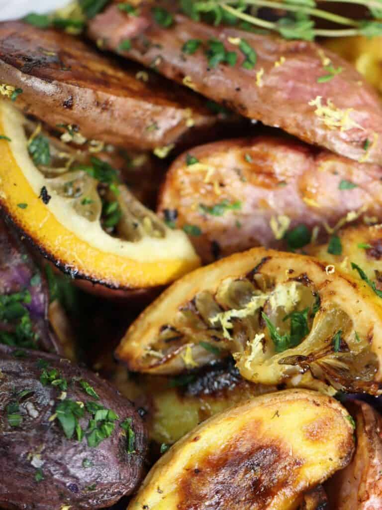 very close look at lemony herby roasted fingerlings with lemon zest and parsley garnish