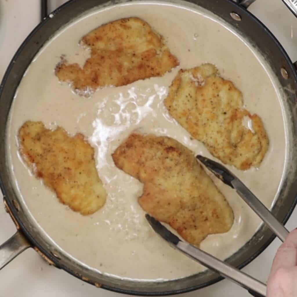 adding chicken cutlets back into thickened sauce