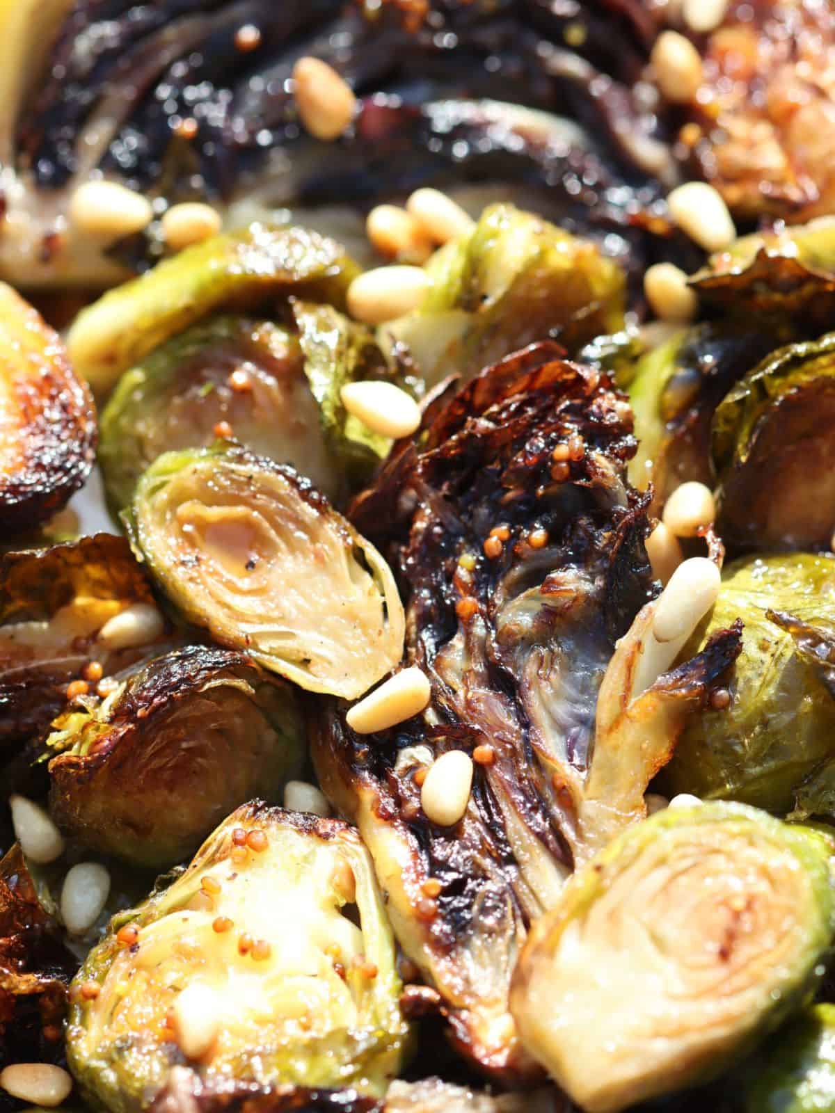 very close look at roasted brussels sprouts and radicchio with maple mustard drizzle