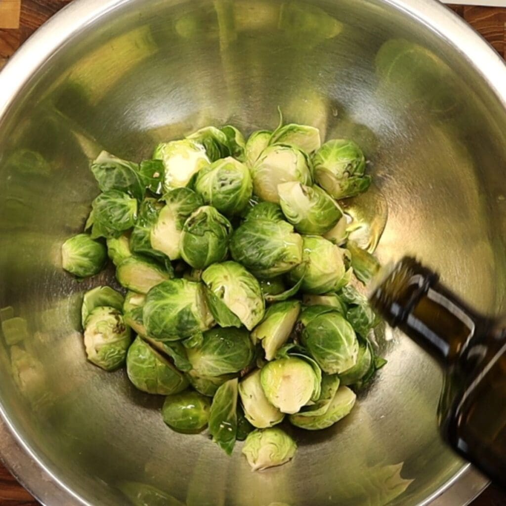 seasoning with olive oil, salt and pepper before roasting