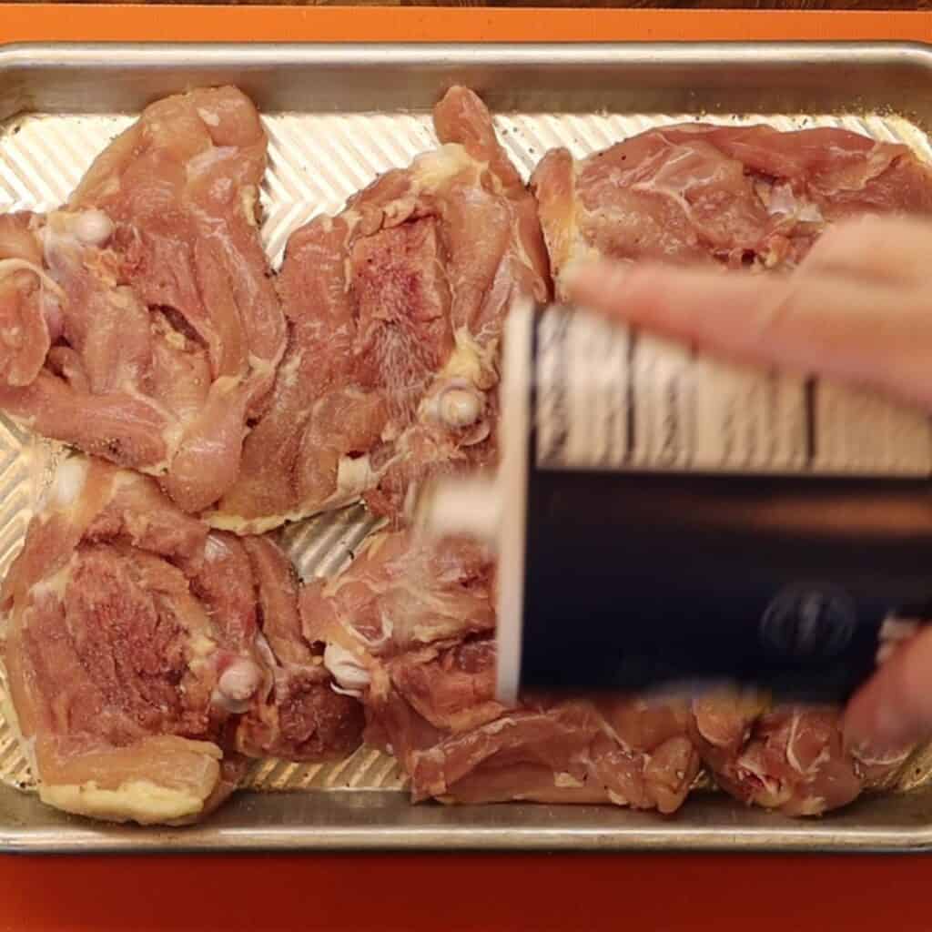 seasoning chicken thighs for crispy saffron chicken thighs with barberries and pigeon peas