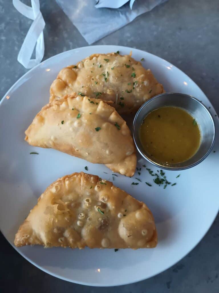 mini puerto rican empanadas with mango sauce