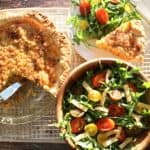 overhead view of sweet potato quiche with bleu cheese and caramelized onions served with a side salad